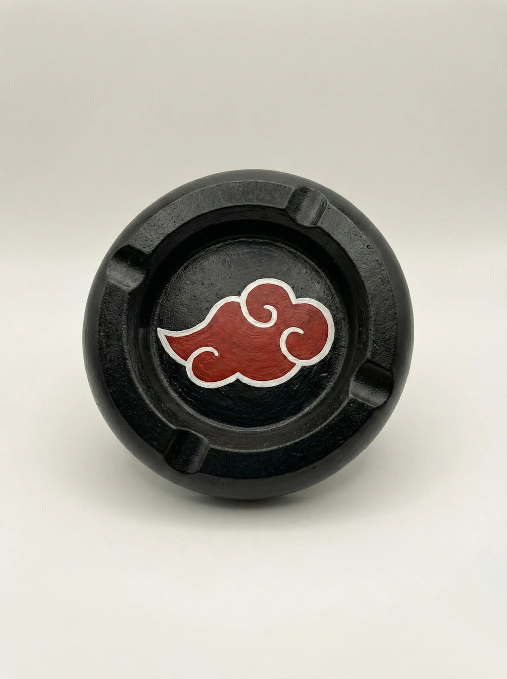 Black circular Akatsuki Ashtray with a red cloud symbol on a white background