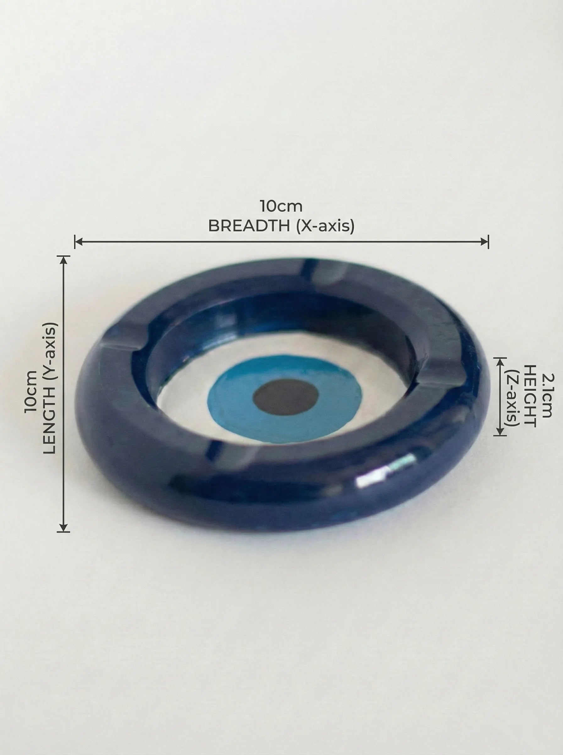 evil eye circular ashtray with measurements on a white background