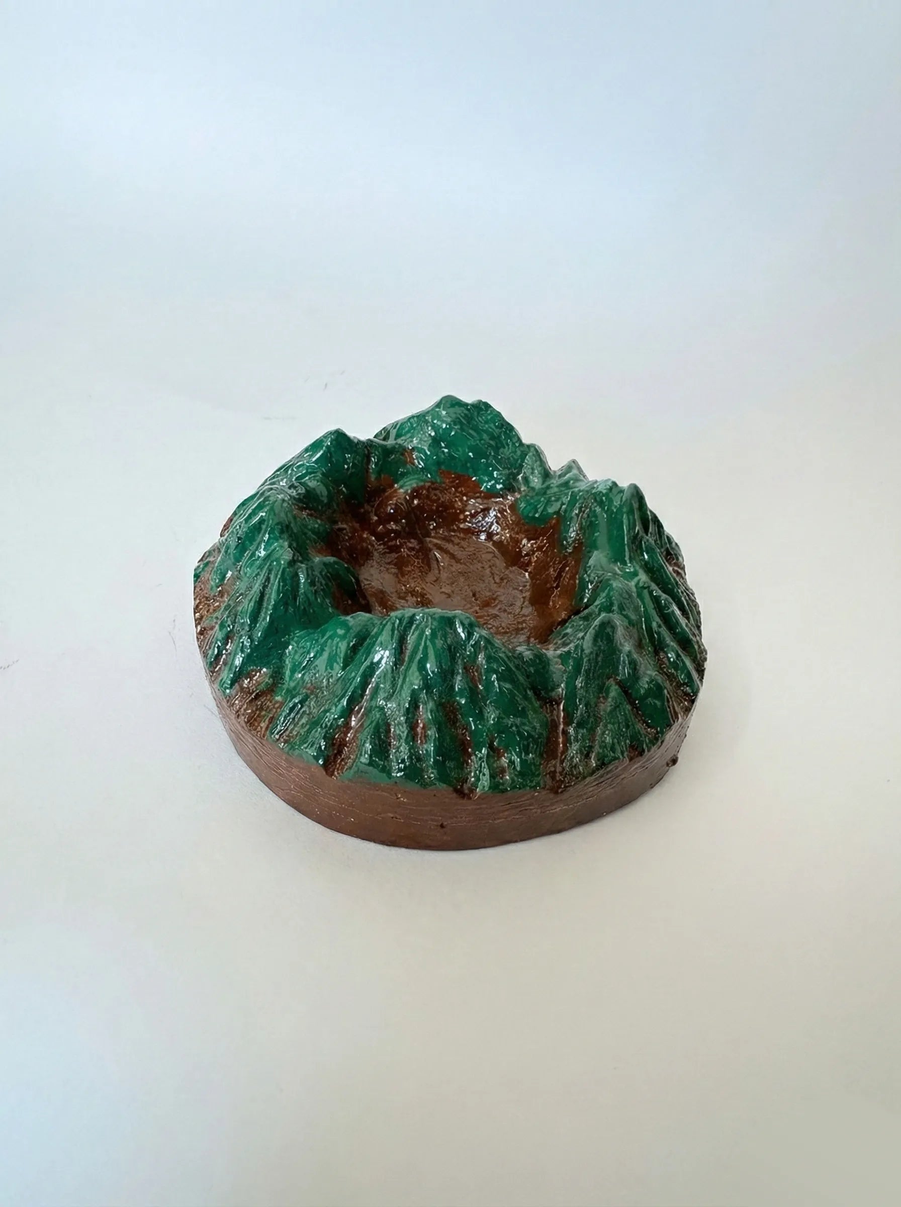 Sahyadri Ashtray with green glaze on a white background
