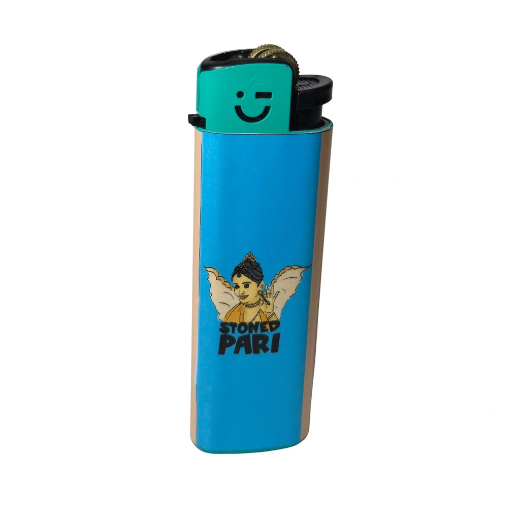 A blue and beige lighter with a graphic of a winged angel and the text 'STONED PARI' on the front, with a turquoise ignition panel featuring a smiley face.