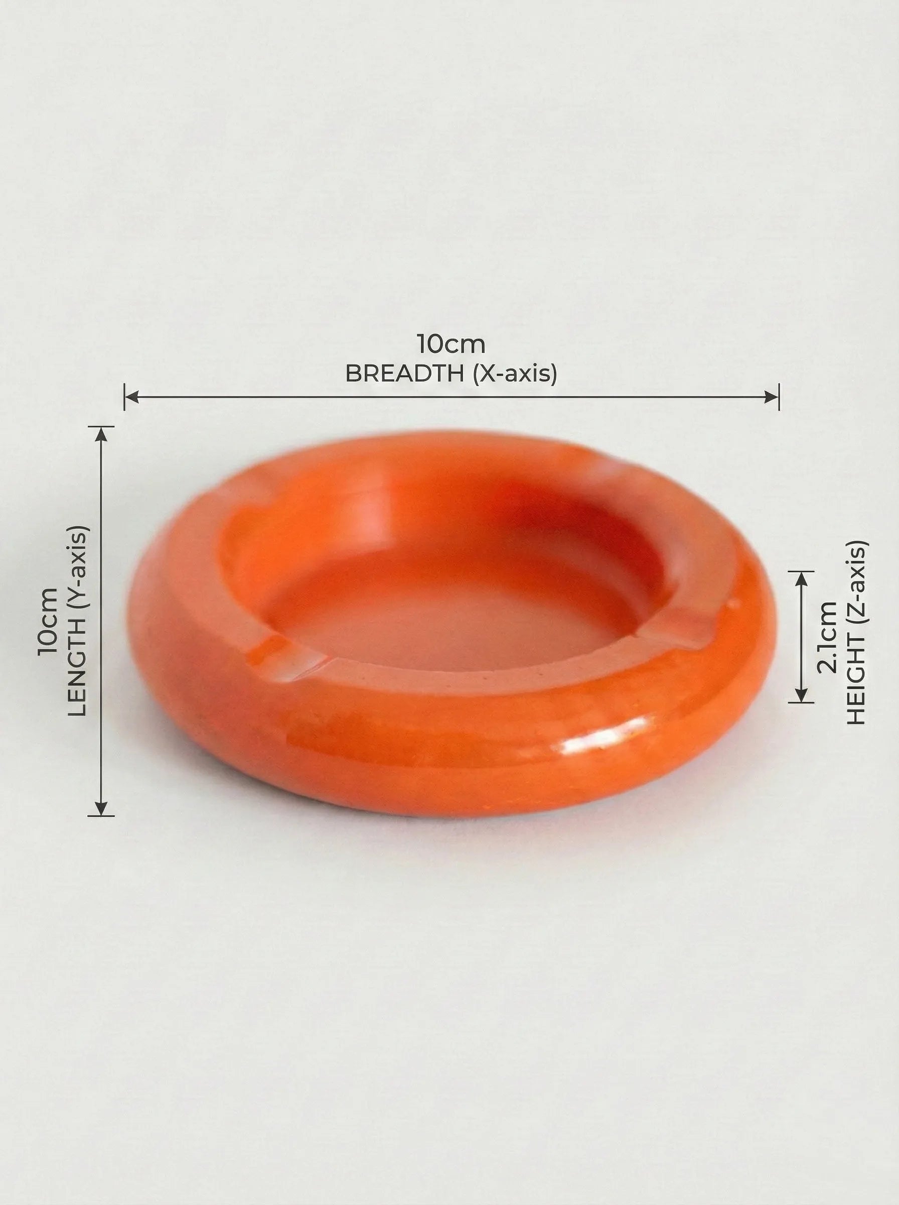 Orange concrete circular ashtray with dimensions labeled on a white background