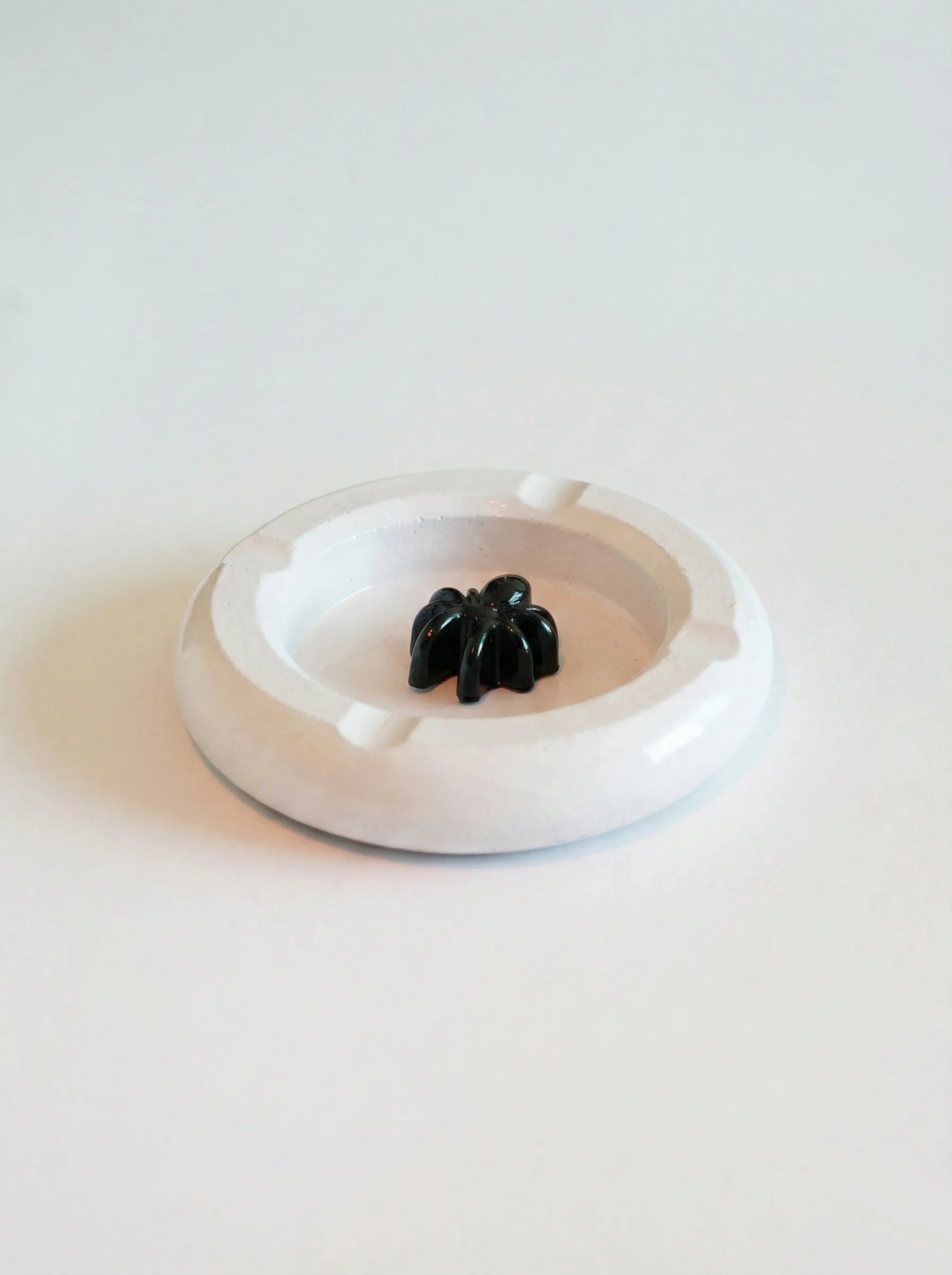 White midnight crawler Ashtray on a white background