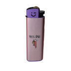 A pink lighter with a purple top and a black nozzle, featuring the text 'YASS RANI' and a small cartoon illustration of a person wearing a crown on the front. which represents women empowerment